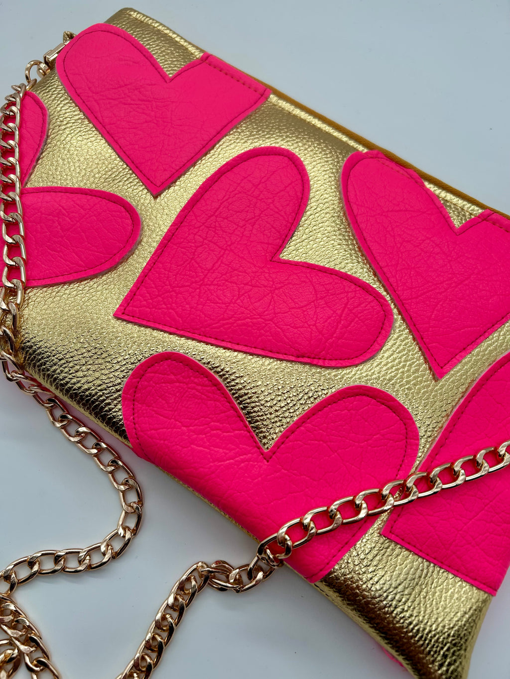 Gold and neon pink heart bag