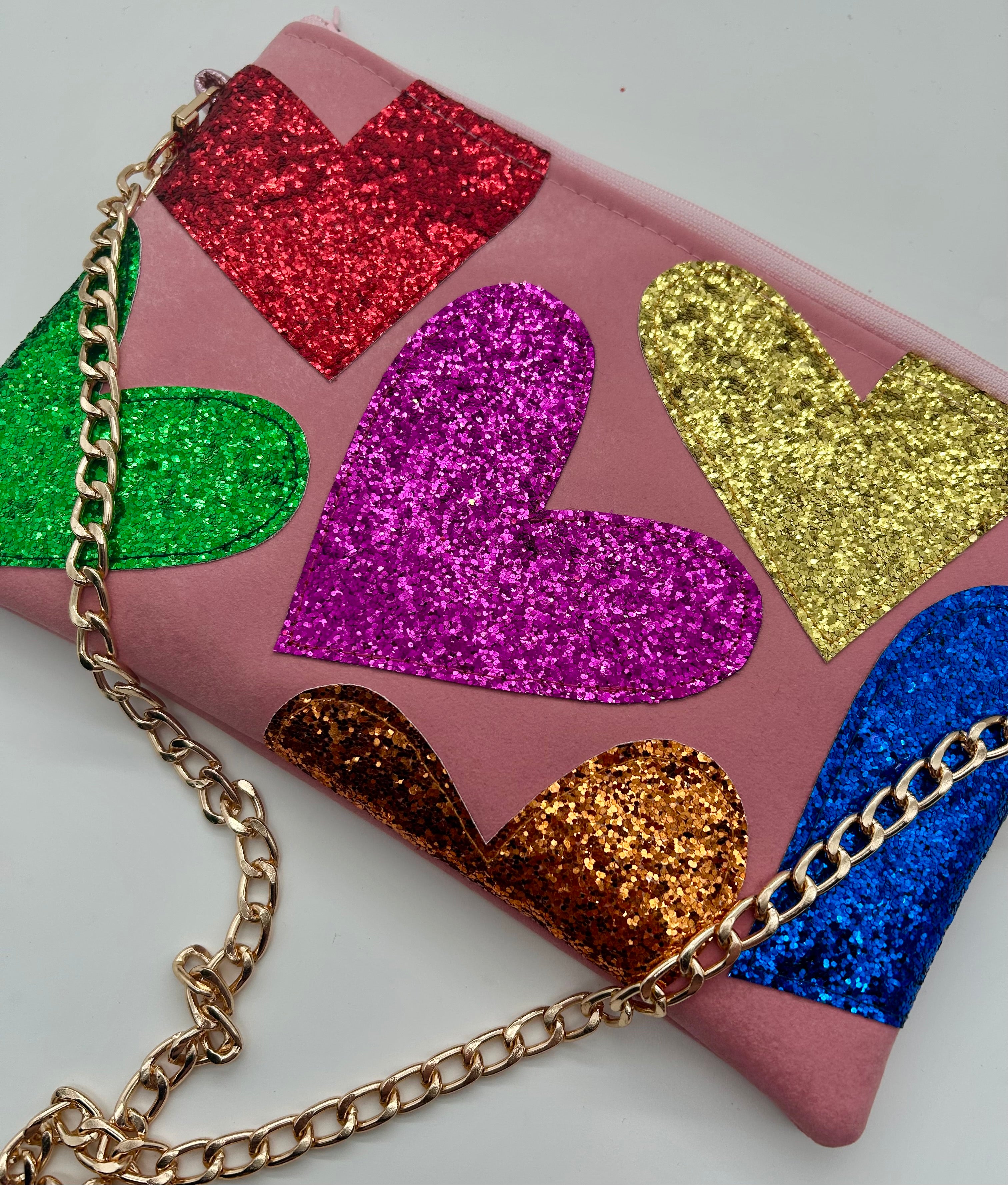 Pale pink faux suede embellished heart glitter bag