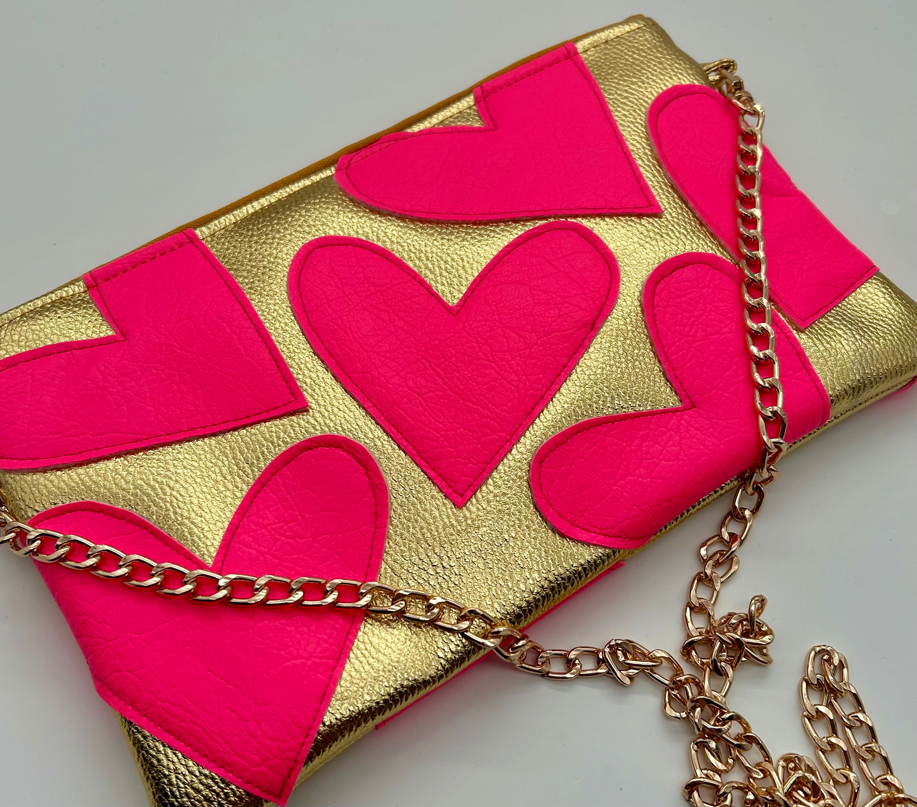 Gold and neon pink heart bag