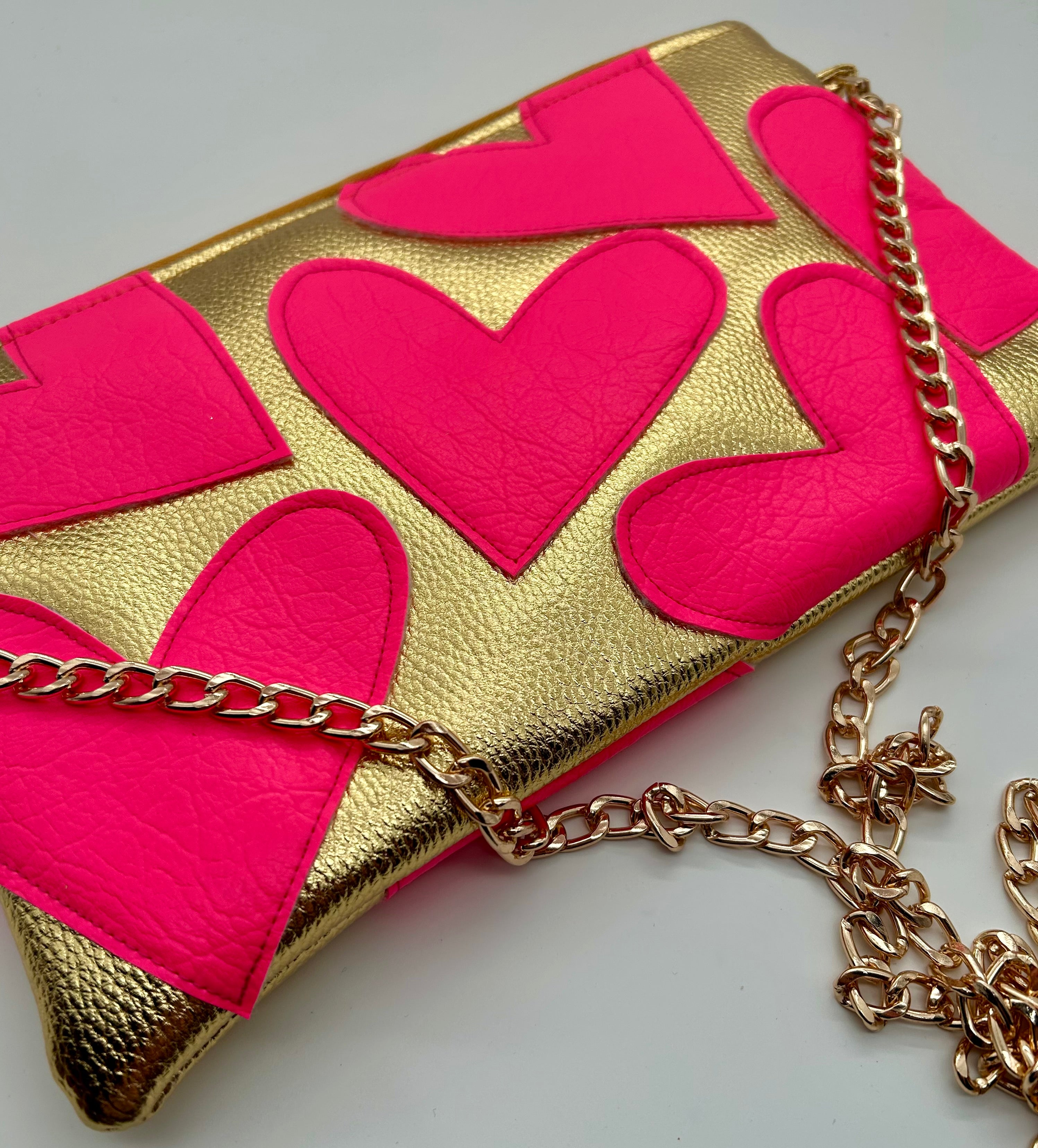 Gold and neon pink heart bag