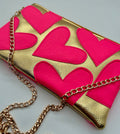 Gold and neon pink heart bag