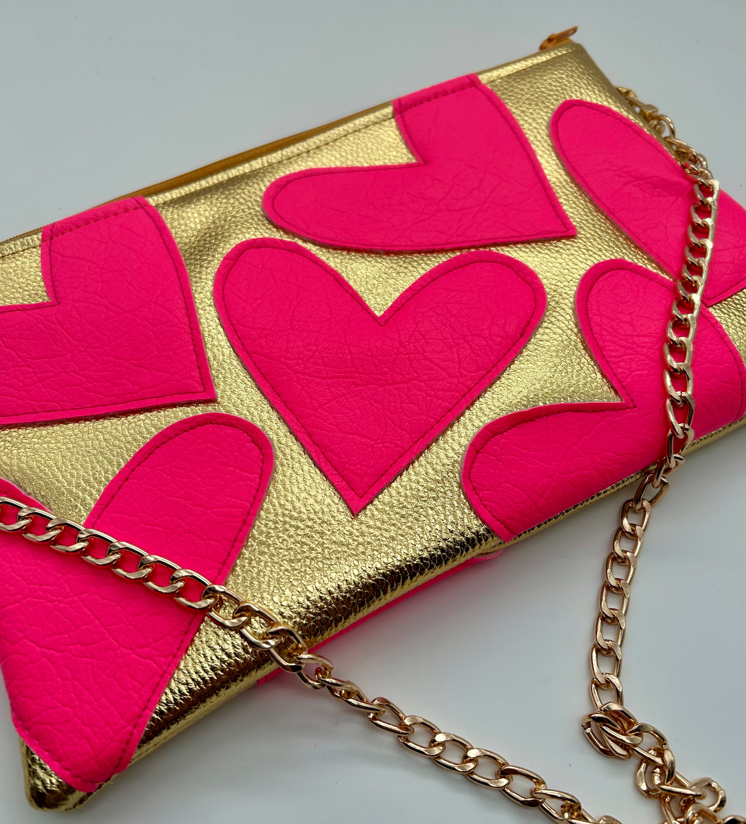 Gold and neon pink heart bag
