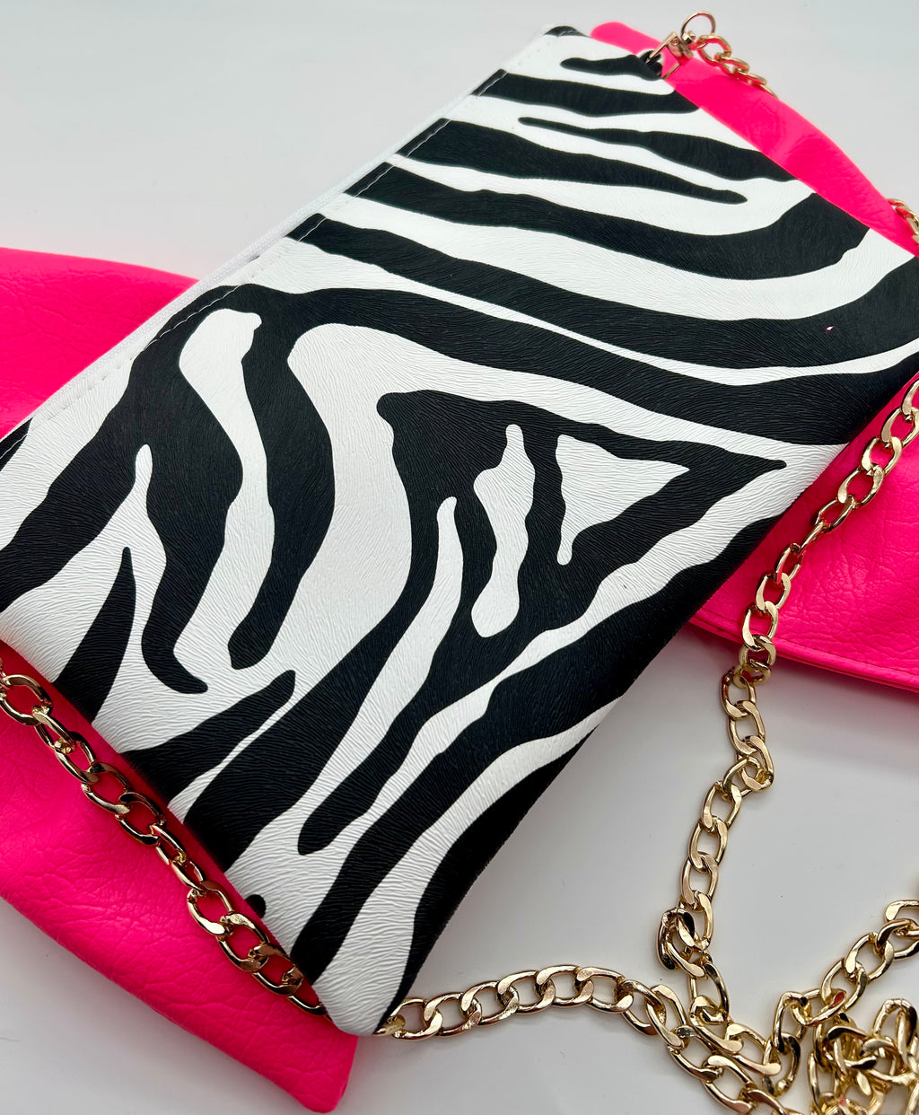 Zebra print bag with large neon pink bow