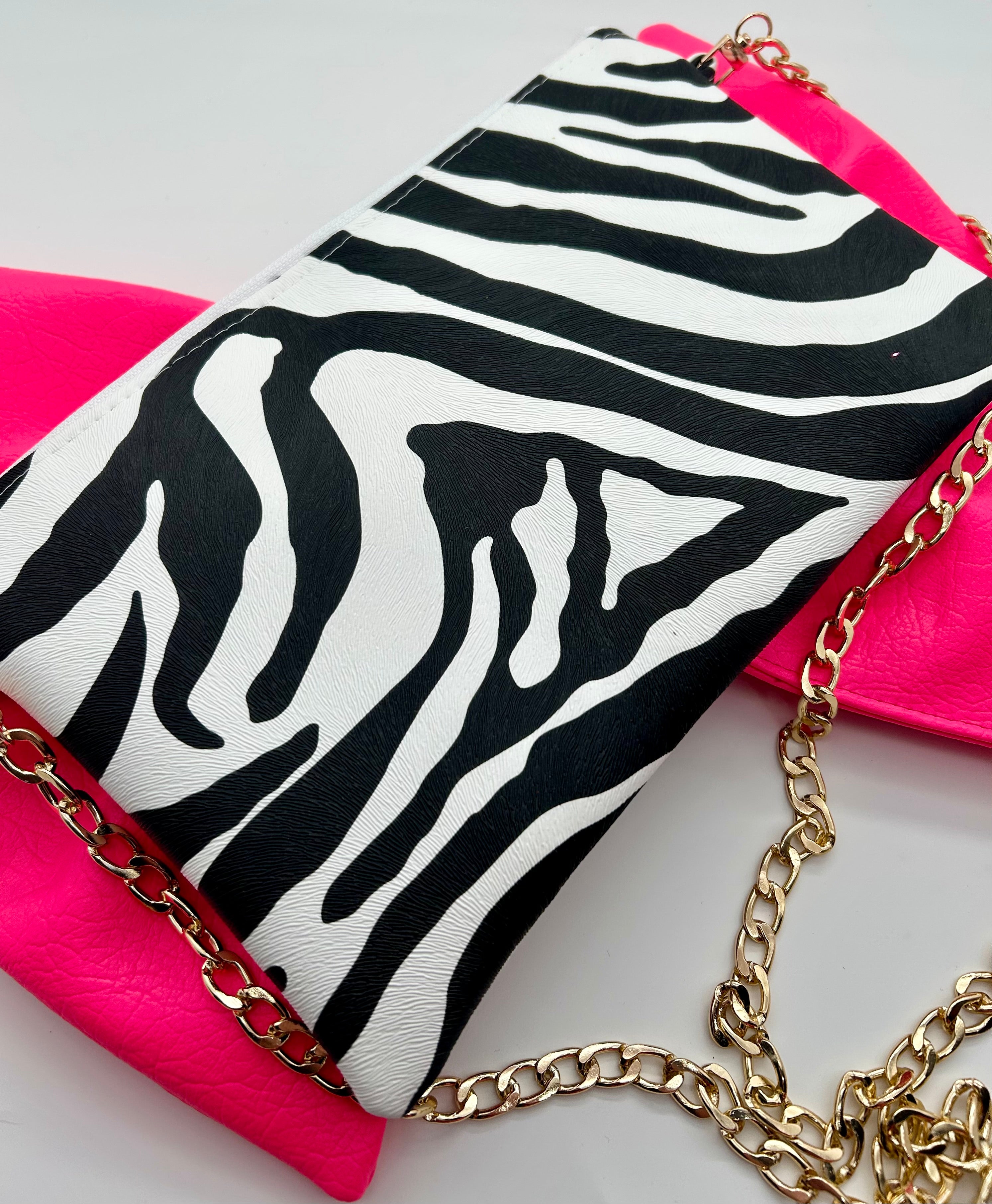 Zebra print bag with large neon pink bow