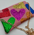 Pale pink faux suede embellished heart glitter bag