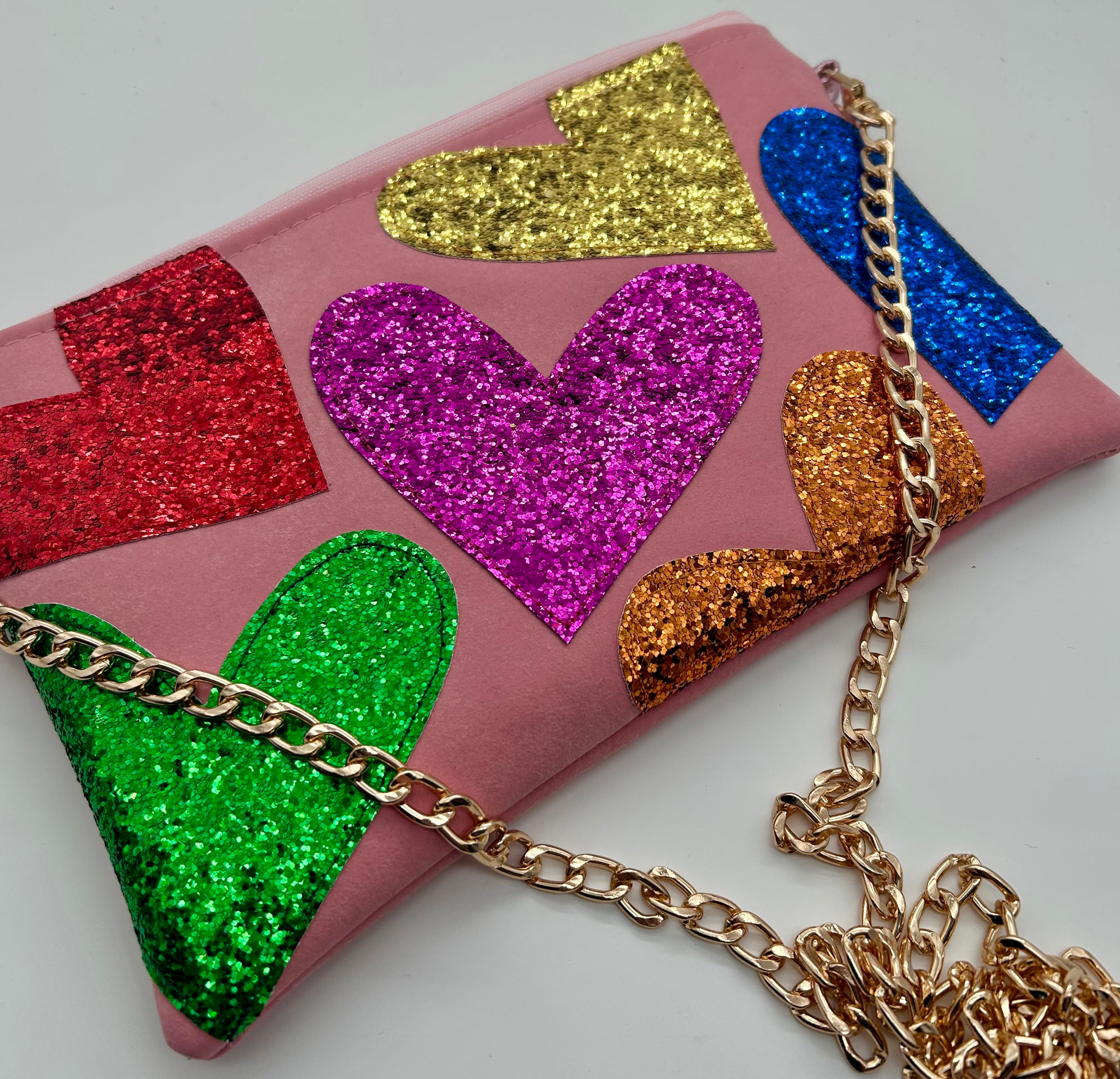 Pale pink faux suede embellished heart glitter bag