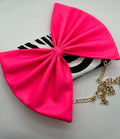 Zebra print bag with large neon pink bow